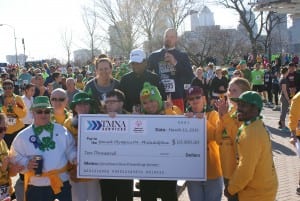 TMNA Services presents their $10,000 presenting sponsor check to Special Olympics Philadelphia athletes